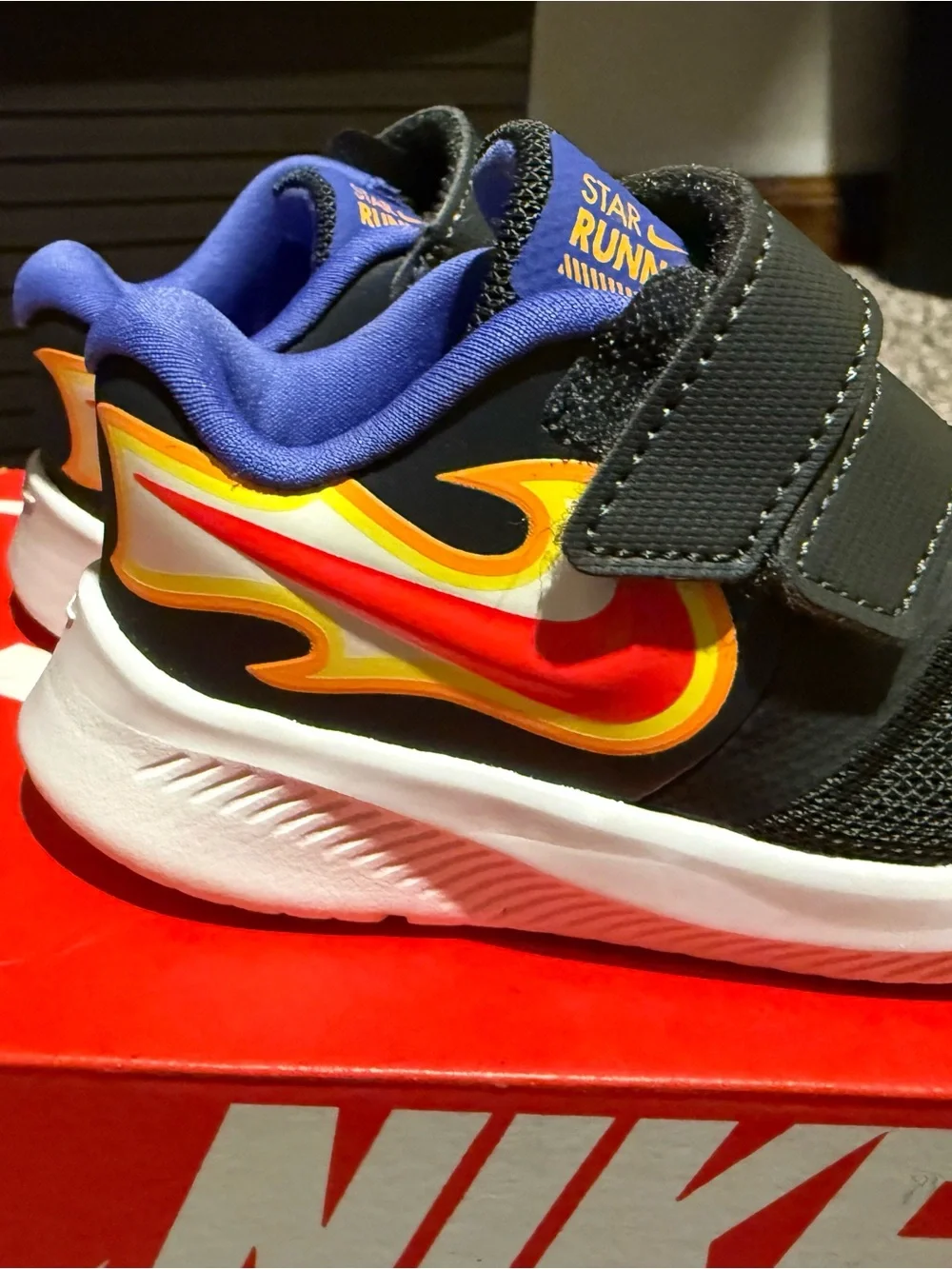 Nike Kids Black Sneakers with Red & Yellow Flame Accent